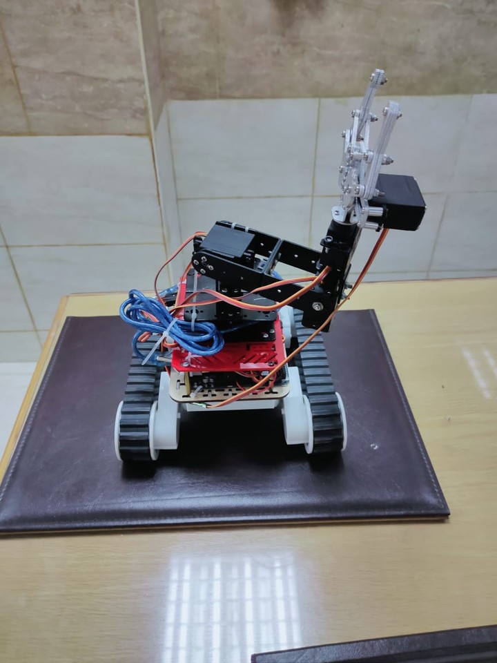 Unmanned vehicle with robotic arm