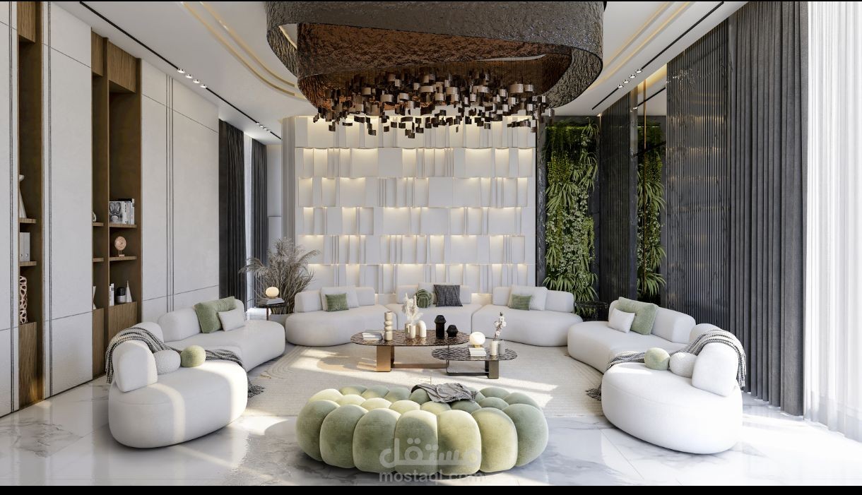 غرفة استقبال النمط هو المودرن الفاخر (Luxury Modern) مع تأثيرات قوية من الطراز المعاصر (Contemporary) ودمج لعناصر البيوفيليك (Biophilic Design) بوجود الجدار النباتي.